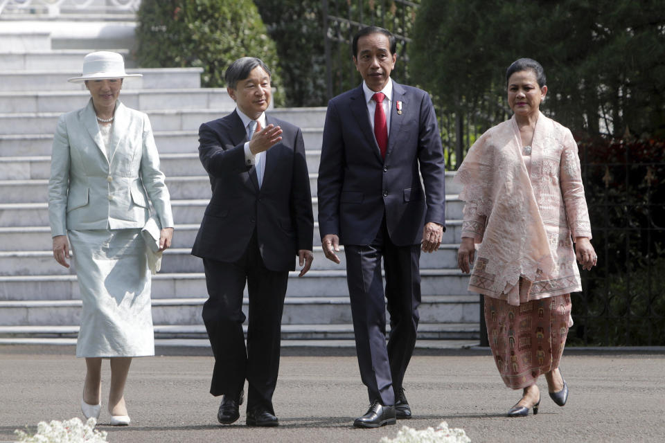 From left, Japan's Empress Masako, Emperor Naruhito, Indonesian President Joko Widodo and his wife Iriana walk to attend a tree planting ceremony during their meeting at Bogor Palace in Bogor, West Java, Indonesia, Monday, June 19, 2023. (Adi Weda/Pool Photo via AP)