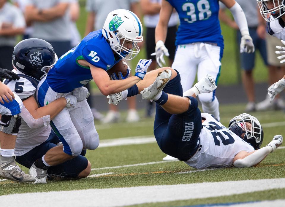 Green Bay Notre Dame's Daniel Hornacek (21) runs the ball in the first half against Bay Port at Notre Dame De La Baie Academy, Friday, August 27, 2021, in Green Bay,