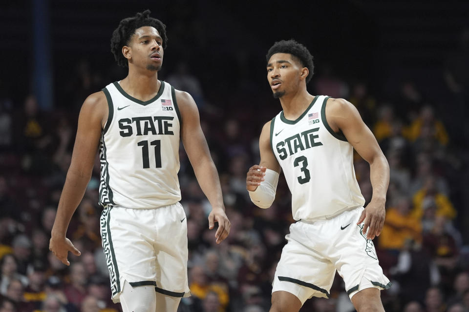 Michigan State guards A.J. Hoggard (11) and Jaden Akins (3) wait for play to resume during the second half of the team's NCAA college basketball game against Minnesota, Tuesday, Feb. 6, 2024, in Minneapolis. (AP Photo/Abbie Parr)