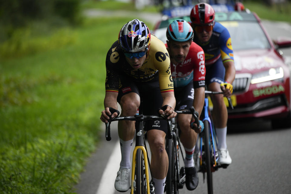 Belgium's Wout Van Aert, Belgium's Victor Campenaerts, and Denmark's Mads Pedersen, from front to rear, ride breakaway during the fifth stage of the Tour de France cycling race over 163 kilometers (101 miles) with start in Pau and finish in Laruns, France, Wednesday, July 5, 2023. (AP Photo/Daniel Cole)