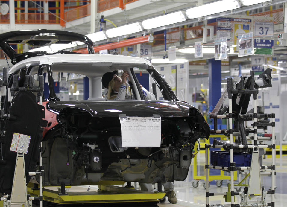 An employee works on a Fiat 500 L car in the assembly hall in the new Fiat factory, in Kragujevac, some 100 kilometers (70 miles) south of Belgrade, Serbia, Monday, April 16, 2012. Italian carmaker Fiat has opened a production line in Serbia for its new 500L family model, to expand on the popularity of its two-door 500 city car. Fiat hopes to sell about 160,000 hatchbacks a year produced in this central Serbian town, to take advantage of low wages, tax breaks and government subsidies. (AP Photo/Darko Vojinovic)