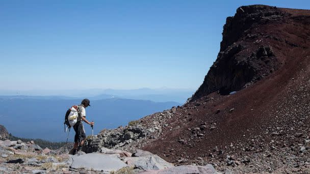 PHOTO: Nick Meyers, lead climbing ranger at Shasta-Trinity National Forest, hikes down after guiding reporters to the site of the June 6 accidents on Mt. Shasta, Calif., July 14, 2022. (Los Angeles Times via Getty Images, FILE)