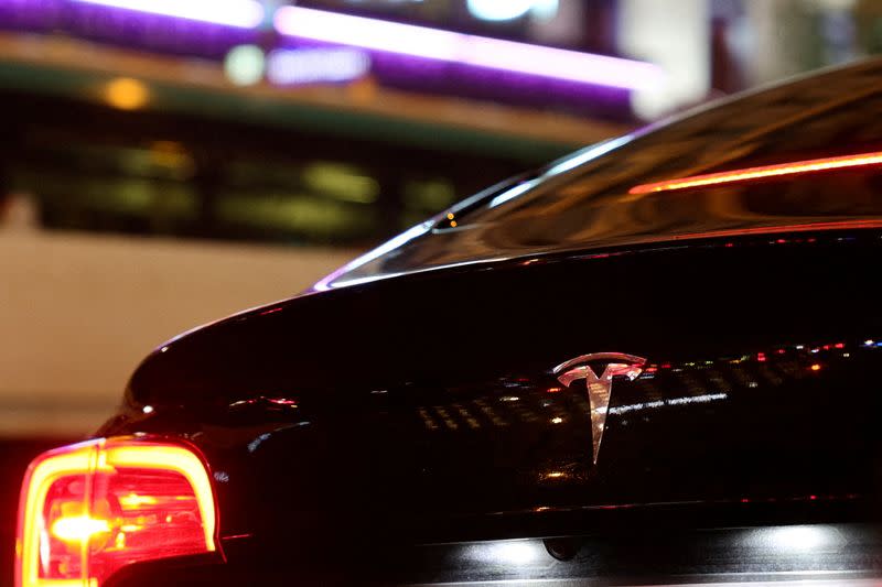 FILE PHOTO: A Tesla logo is seen on a Parisian taxi car in Paris