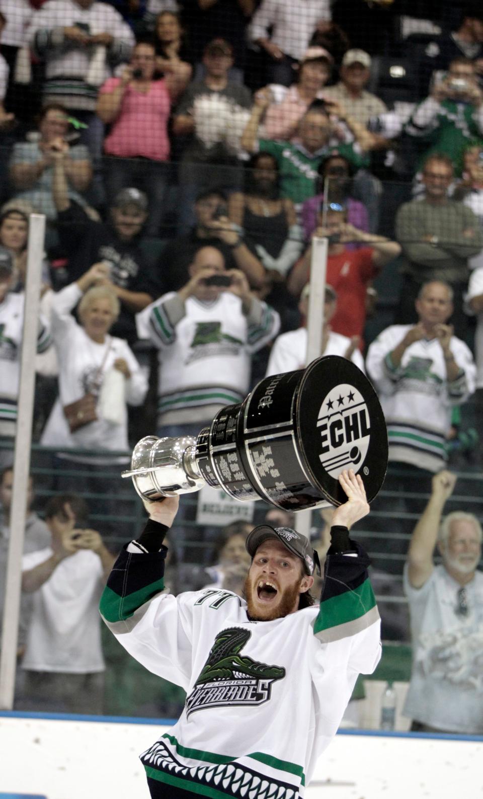 Everblades' Brandon MacLean (77) celebrates with the Kelly Cup after the Everblades won 3-2 in overtime clinching their first ECHL Kelly Cup at Germain Arena on Wednesday, May 23, 2012. MacLean scored the Cup-clinching goal in overtime.