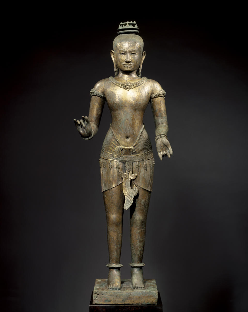 This March 2007 photo shows a bronze sculpture titled "Standing Shiva" at the Metropolitan Museum of Art in New York. The sculpture is one of 16 pieces of artwork that the museum said it will return to Cambodia and Thailand that federal prosecutors say were tied to an art dealer and collector accused of running a huge antiquities trafficking network out of Southeast Asia. (Metropolitan Museum of Art via AP)