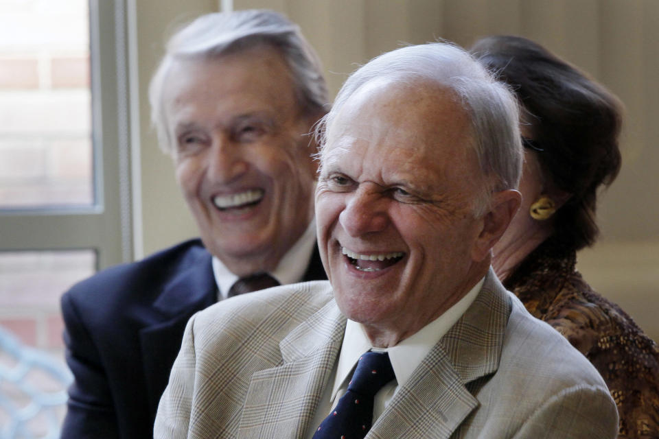FILE - Former U.S. Sens. David Pryor, foreground, and Dale Bumpers, both D-Ark., laugh at a joke during a meeting at the Governor's Mansion, Sept. 18, 2013, in Little Rock, Ark. Former Arkansas governor and U.S. Sen. David Pryor, a Democrat who was one of the state’s most beloved political figures and remained active in public service in the state long after he left office, has died. He was 89. (AP Photo/Danny Johnston, File)