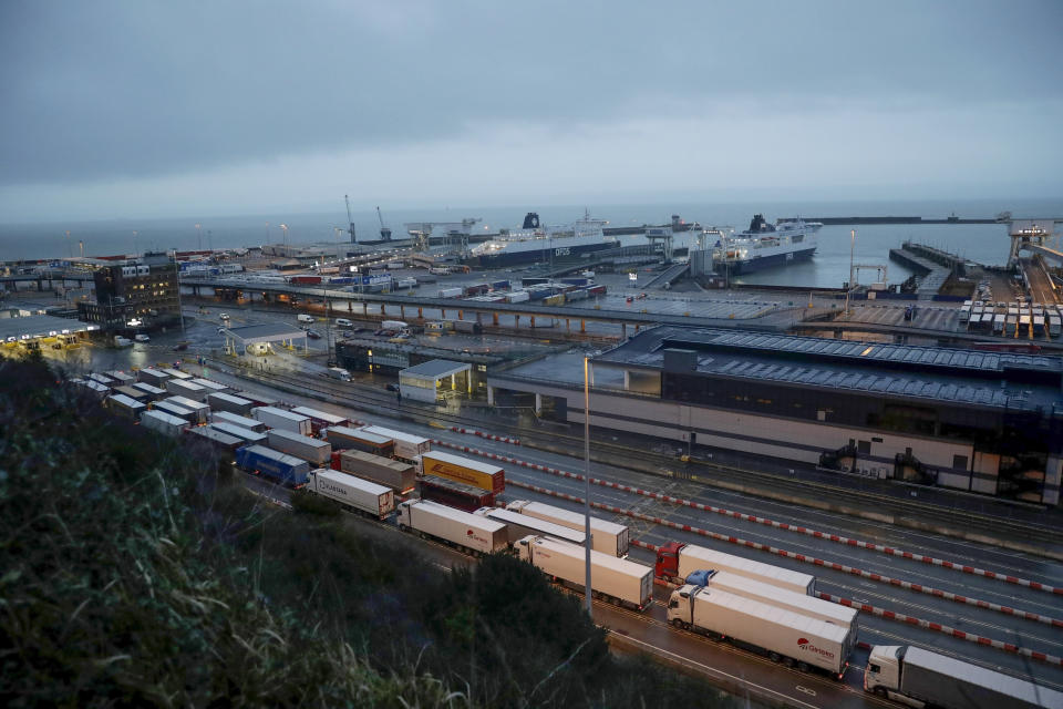 FILE - In this Saturday, Feb. 1, 2020 file photo, lorries wait to board ferries on the morning after Brexit took place at the Port of Dover, in Dover, England. The British government says there could be lines of 7,000 trucks at the English Channel and two-day waits to get into France immediately after the U.K. makes its economic break from the European Union at the end of the year. Brexit preparation minister Michael Gove describes that as a reasonable worst-case scenario in a letter to logistics firms. (AP Photo/Matt Dunham, FILE)