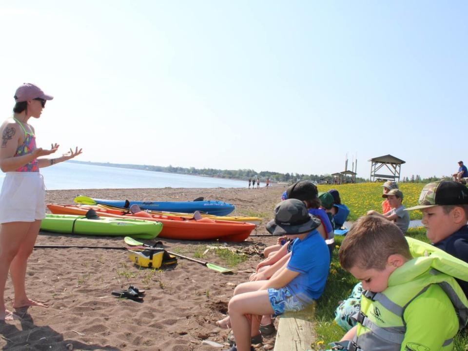 Jasmine LaBillois speaks to her forest and nature school students about the importance of oceans, rivers and salmon to the Mi'kmaq.  (Oscar Baker III/CBC - image credit)