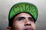 David, 15, a member of a migrants caravan from Central America, poses for a photo at the end of the caravan's trip through Mexico, prior to preparations for an asylum request in the U.S., in Tijuana, Baja California state, Mexico April 26, 2018. The words read "Chinese". REUTERS/Edgard Garrido