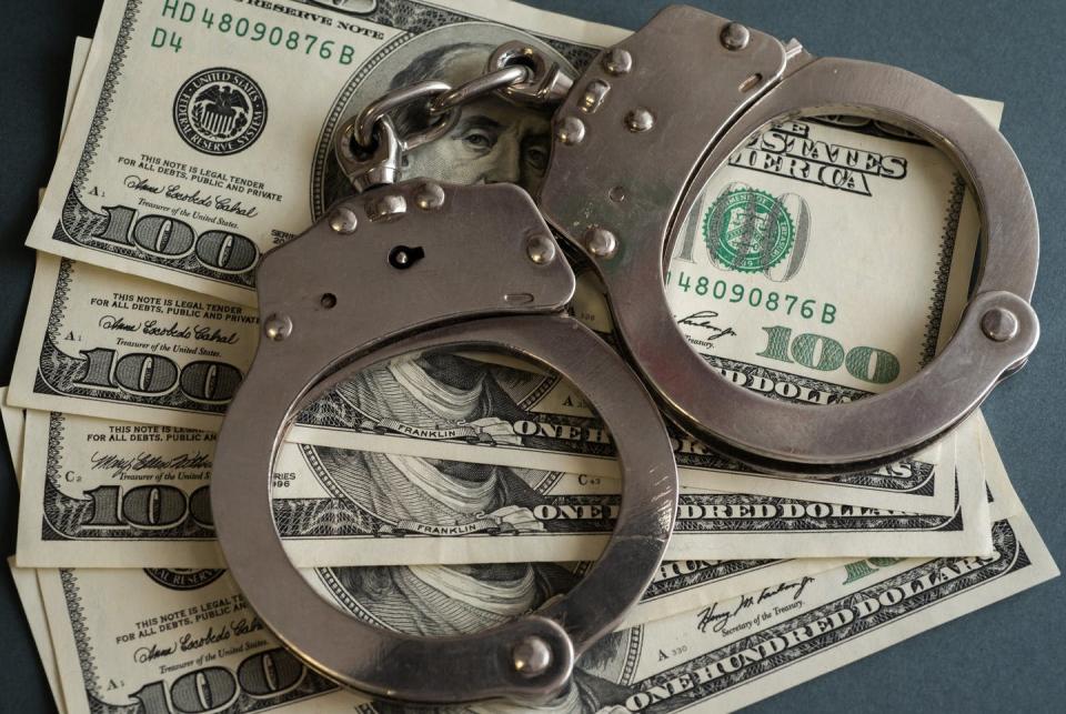 <span class="caption">These funds help people stay out of jail while awaiting trial.</span> <span class="attribution"><a class="link " href="https://www.gettyimages.com/detail/news-photo/in-this-photo-illustrations-handcuffs-and-hundred-us-dollar-news-photo/1230511420?adppopup=true" rel="nofollow noopener" target="_blank" data-ylk="slk:SOPA Images/LightRocket via Getty Images">SOPA Images/LightRocket via Getty Images</a></span>