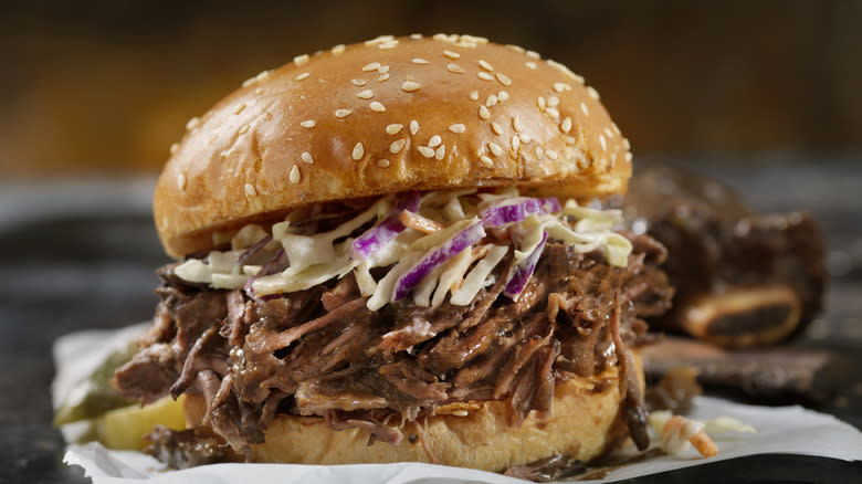 Coleslaw on a pulled pork sandwich