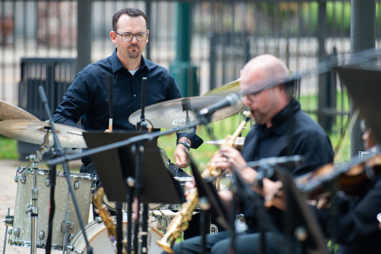 Drummer DJ Culp keeps the rhythm as the Jackson Symphony's "Symphony on the Move" performs outside the Jackson-Madison County Library on Monday, Jun. 12, 2023. 