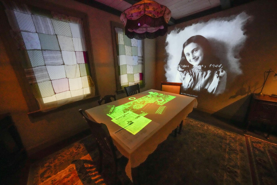 A portrait of Anne Frank is part of a replica of the home in Amsterdam where she hid, as part of the new pavilion opening at the National World War II Museum in New Orleans, Tuesday, Oct. 31, 2023. The latest major addition to the museum is called the Liberation Pavilion. And it's ambitious in scope. The grim yet hopeful addition addresses the conflict's world-shaping legacy. (AP Photo/Gerald Herbert)