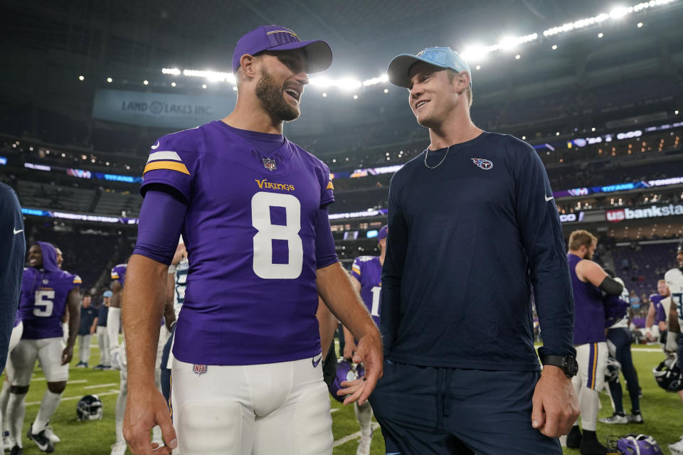 Minnesota Vikings quarterback Kirk Cousins (8) and Tennessee Titans quarterback Ryan Tannehill, right, talk on the field afger their team's preseason NFL football game, Saturday, Aug. 19, 2023, in Minneapolis. (AP Photo/Charlie Neibergall)