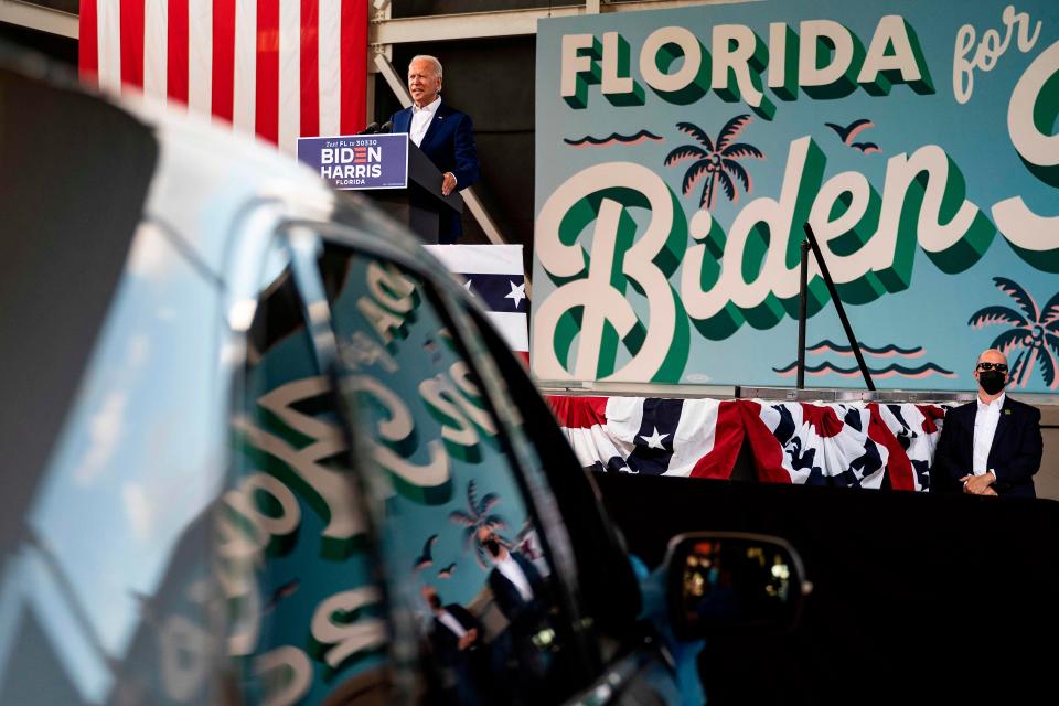 Democratic presidentia nominee Joe Biden speaks during a drive-in rally in Miramar, Florida on October 13, 2020. Biden is courting elderly Americans who helped elect President Donald Trump four years ago but appear to be swinging to the Democratic candidate this time.