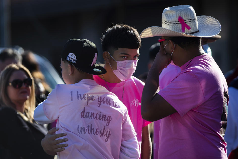 A man wears a t-shirt that reads "I hope you're dancing in the sky" in memory of Astroworld victim Brianna Rodriguez who was known for being a dancer as family, friends and community members gathered at La Paz Memorial Funeral Home to remember Rodriguez, Saturday, Nov. 13, 2021, in Houston. Rodriguez died from injuries sustained during a stampede at the Astroworld music festival. (Marie D. De Jesús/Houston Chronicle via AP)