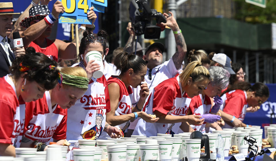 Female contestants participate in the competition in Coney Island (Major League Eating/PA)