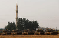 Turkish army tanks are stationed in Karkamis on the Turkish-Syrian border in the southeastern Gaziantep province, Turkey, August 25, 2016. REUTERS/Umit Bektas