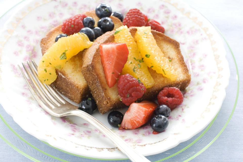 In this image taken on March 11, 2013, pan-seared pound cake with minty fruit salad is shown served on a plate in Concord, N.H. (AP Photo/Matthew Mead)