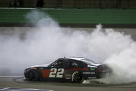 Austin Cindric (22) celebrates after winning a NASCAR Xfinity Series auto race Friday, July 10, 2020, in Sparta, Ky. (AP Photo/Mark Humphrey)