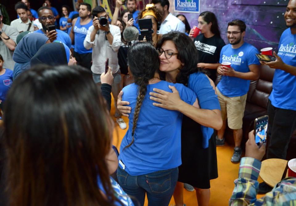 Rashida Tlaib greets family and supporters at the MotorCity Java House in Detroit on Aug. 7, 2018.