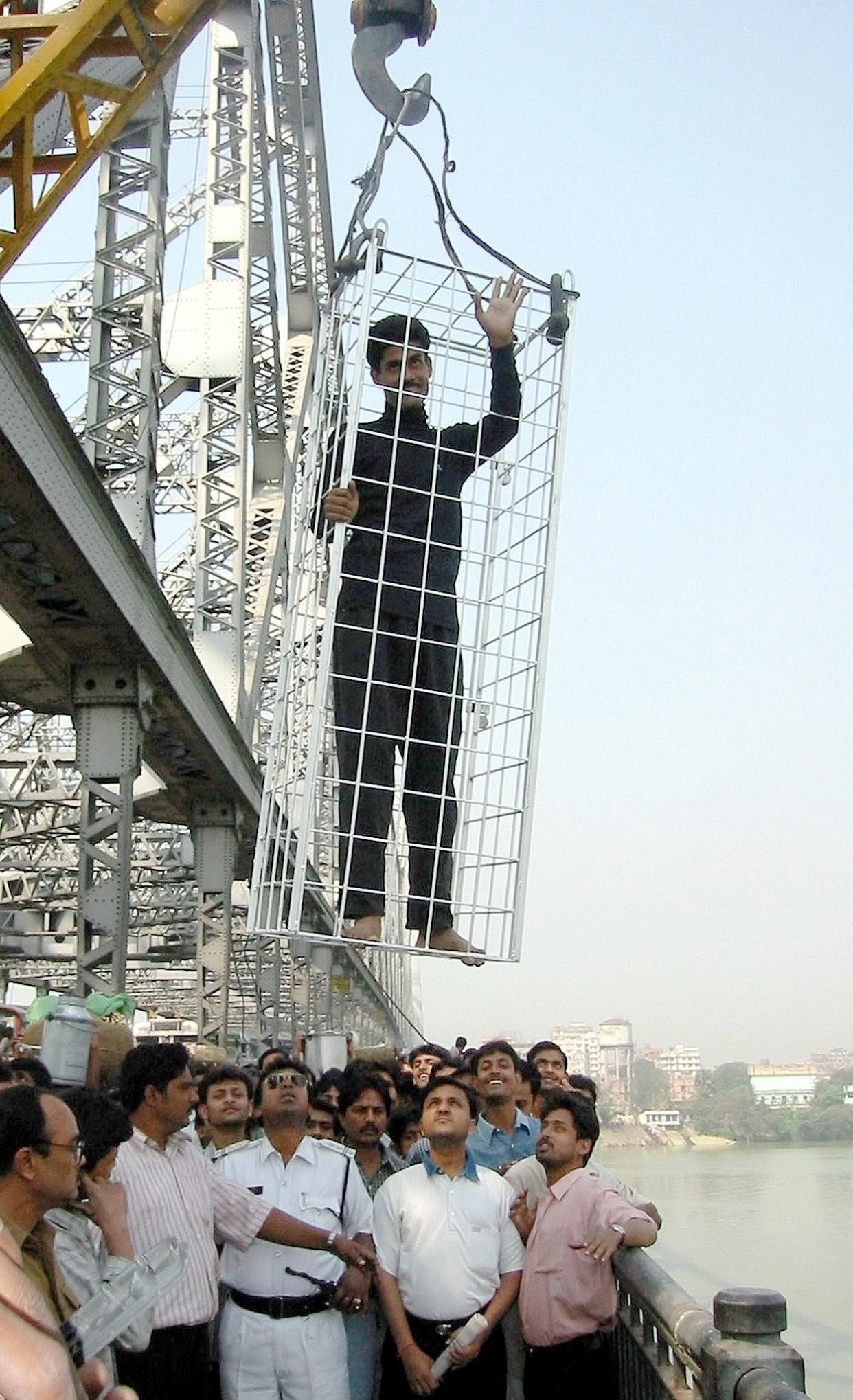 Mr Lahiri waves to the crowd before a previous stunt in the Hooghly river in 2002 (Picture: Reuters)