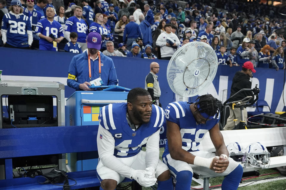 Indianapolis Colts linebacker Zaire Franklin (44) sits on the bench with Indianapolis Colts linebacker Bobby Okereke (58) following their NFL football game against the Houston Texans, Sunday, Jan. 8, 2023, in Indianapolis. The Houston Texans defeated the Indianapolis Colts 32-31. (AP Photo/Darron Cummings)