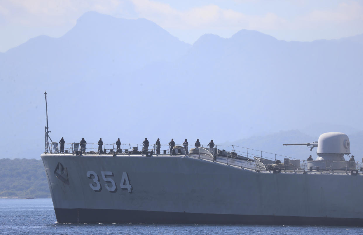 Indonesian navy ship Oswad Siahaan sails to join the search for submarine KRI Nanggala that went missing while participating in a training exercise, off Banyuwangi, East Java, Indonesia, Saturday, April 24, 2021. The oxygen supply for the 53 crew members of the Indonesian submarine missing in waters off Bali is believed to have run out early Saturday with no sign of the vessel while the search resumed, bolstered by the arrival of a sonar-equipped Australian warship. (AP Photo/Achmad Ibrahim)