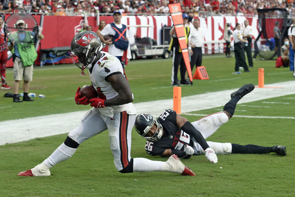 Tampa Bay Buccaneers wide receiver Chris Godwin (14) beats Atlanta Falcons cornerback Isaiah Oliver (26) on a 12-yard touchdown reception during the second half of an NFL football game Sunday, Sept. 19, 2021, in Tampa, Fla. (AP Photo/Jason Behnken)