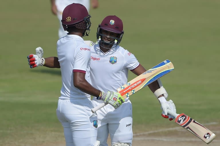 Shane Dowrich (right) and Kraigg Brathwaite celebrate after West Indies won the third Test against Pakistan in Sharjah on November 3, 2016