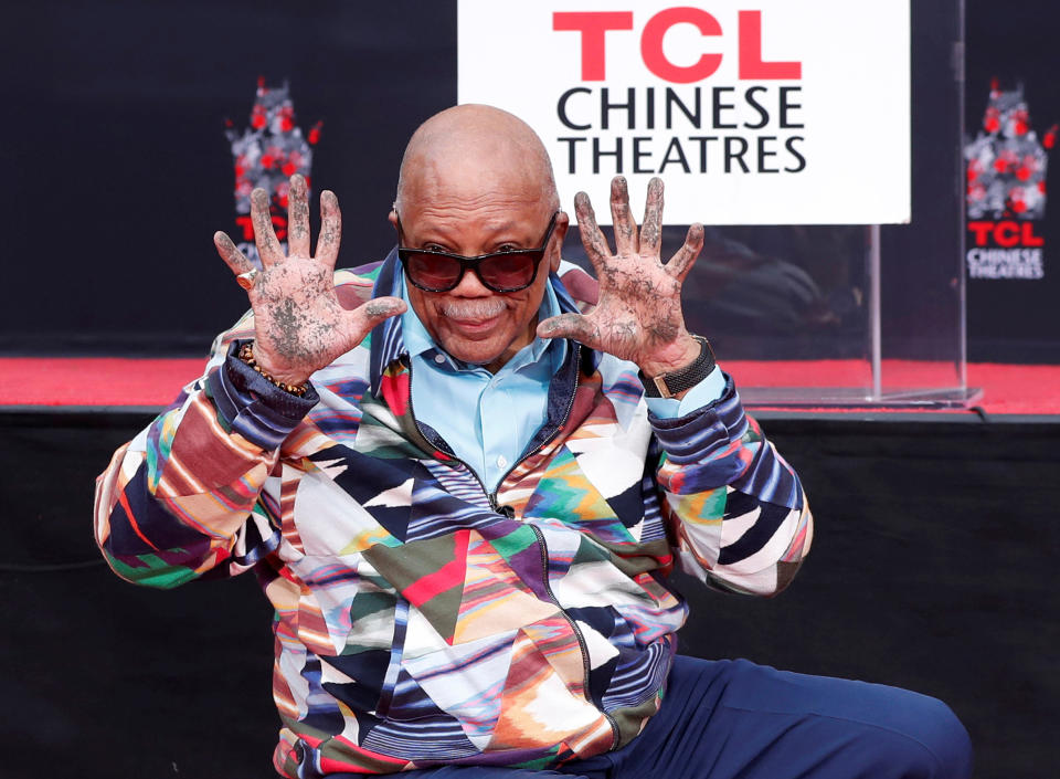 Composer Quincy Jones shows his hands after placing them in cement during a ceremony in the forecourt of the TCL Chinese theatre in Los Angeles, California, U.S., November 27, 2018. REUTERS/Mario Anzuoni     TPX IMAGES OF THE DAY