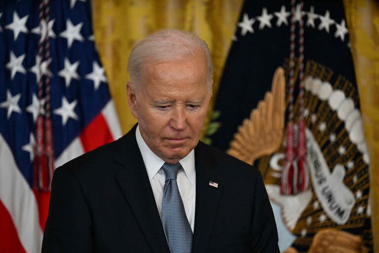 (FILES) US President Joe Biden speaks during a Medal of Honor Ceremony in the East Room of the White House in Washington, DC, on July 3, 2024. US President Joe Biden announced July 21, 2024 that he is dropping out of his reelection battle with Donald Trump, in a historic move that plunges the already turbulent 2024 White House race into uncharted territory. (Photo by Jim WATSON / AFP)