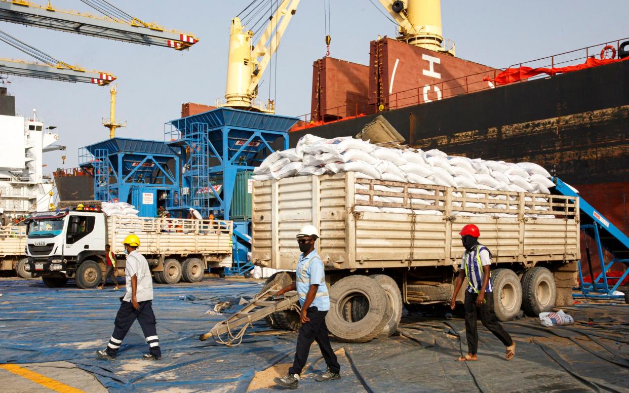 Grain from US Aid unloaded from a ship and bagged at Berbera Port in Somaliland