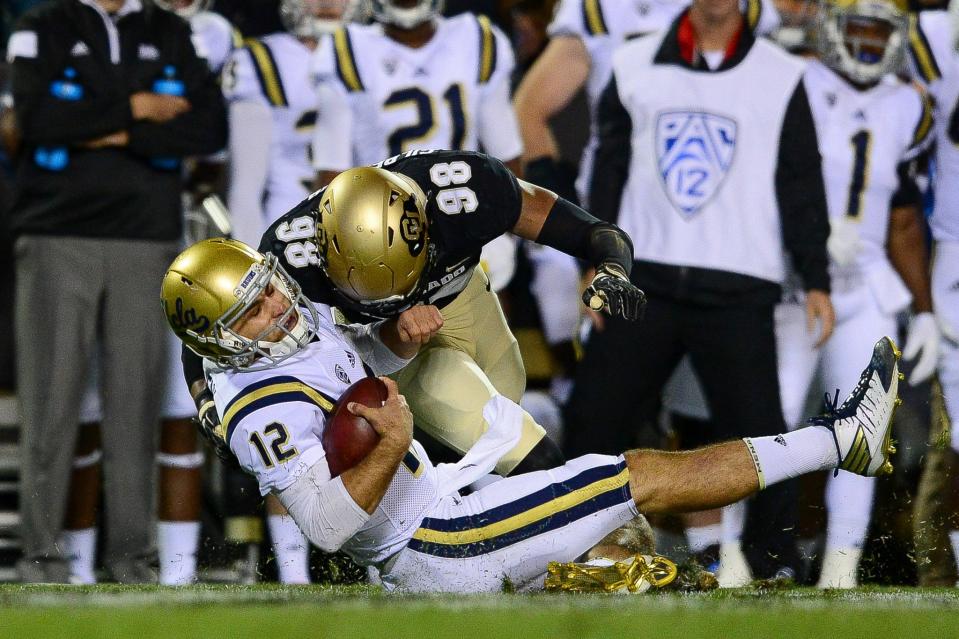 This hit on UCLA QB Mike Fafaul got a targeting penalty in 2016. (Getty)