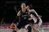 South Korea's Ji Su Park (19), front, drives around Canada's Bridget Carleton (6) during women's basketball preliminary round game at the 2020 Summer Olympics, Thursday, July 29, 2021, in Saitama, Japan. (AP Photo/Eric Gay)