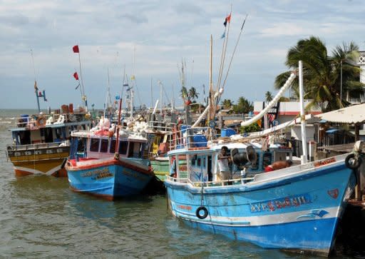 Fishing boats in the harbour at Negombo. A thin layer of oil has been seen off the popular coastal resort, navy sources say