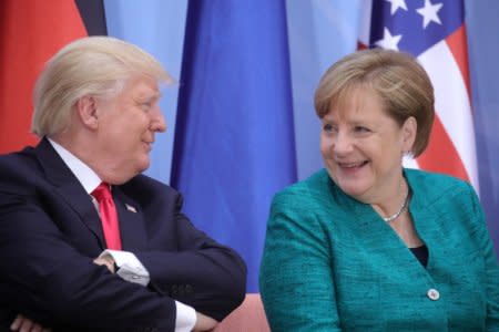 FILE PHOTO: U.S. President Donald Trump and German Chancellor Angela Merkel attend the Women’s Entrepreneurship Finance event during the G20 leaders summit in Hamburg, Germany July 8, 2017.  REUTERS/Michael Kappeler, Pool