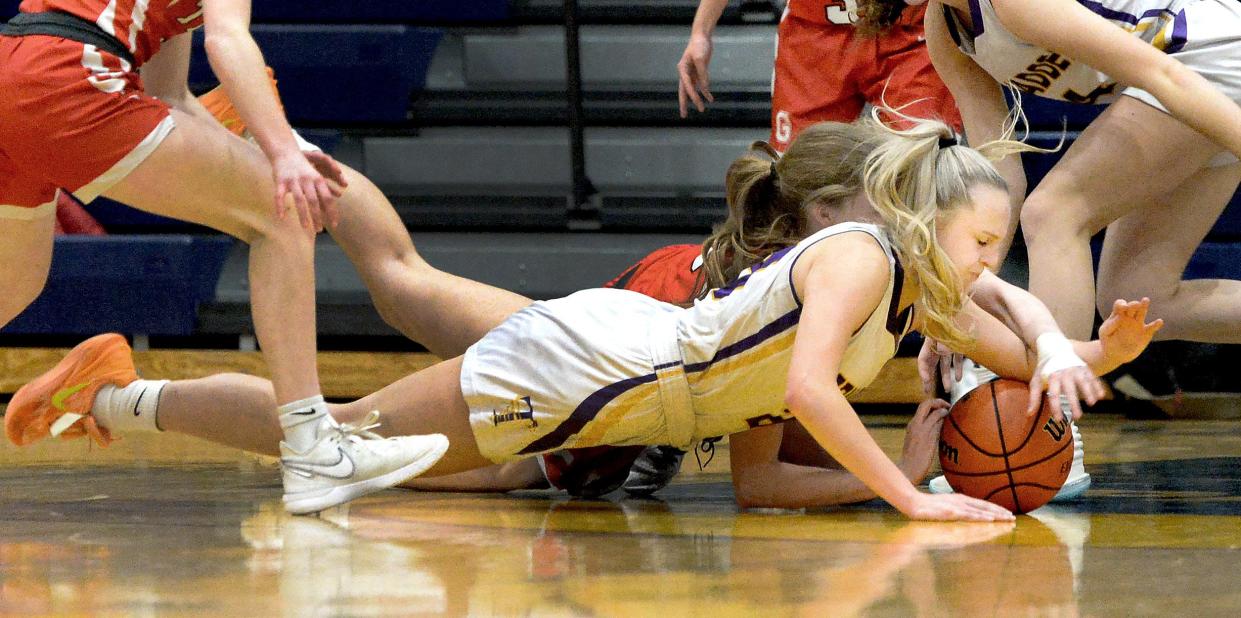 Taylorville's Addison Tarr dives for a loose ball during the game against Glenwood during the Class 3A Southeast Regional girls basketball championship game on Friday, Feb. 16, 2024 at Herb Scheffler Gymnasium.