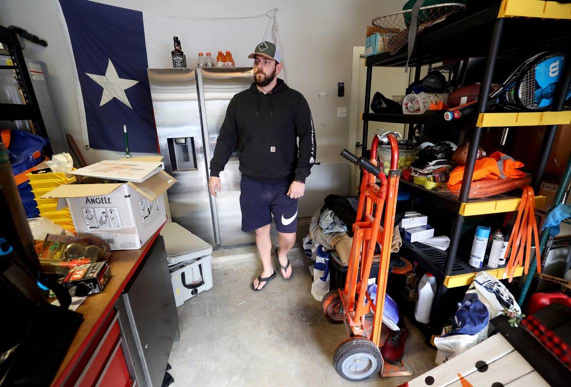 Dane Wicks walks through his garage where items are being stored while his townhome is repaired from damage caused by flooding during last summer’s rainstorms. Wicks lives in the Linwood neighborhood of Fort Worth which is at a high risk of flooding.