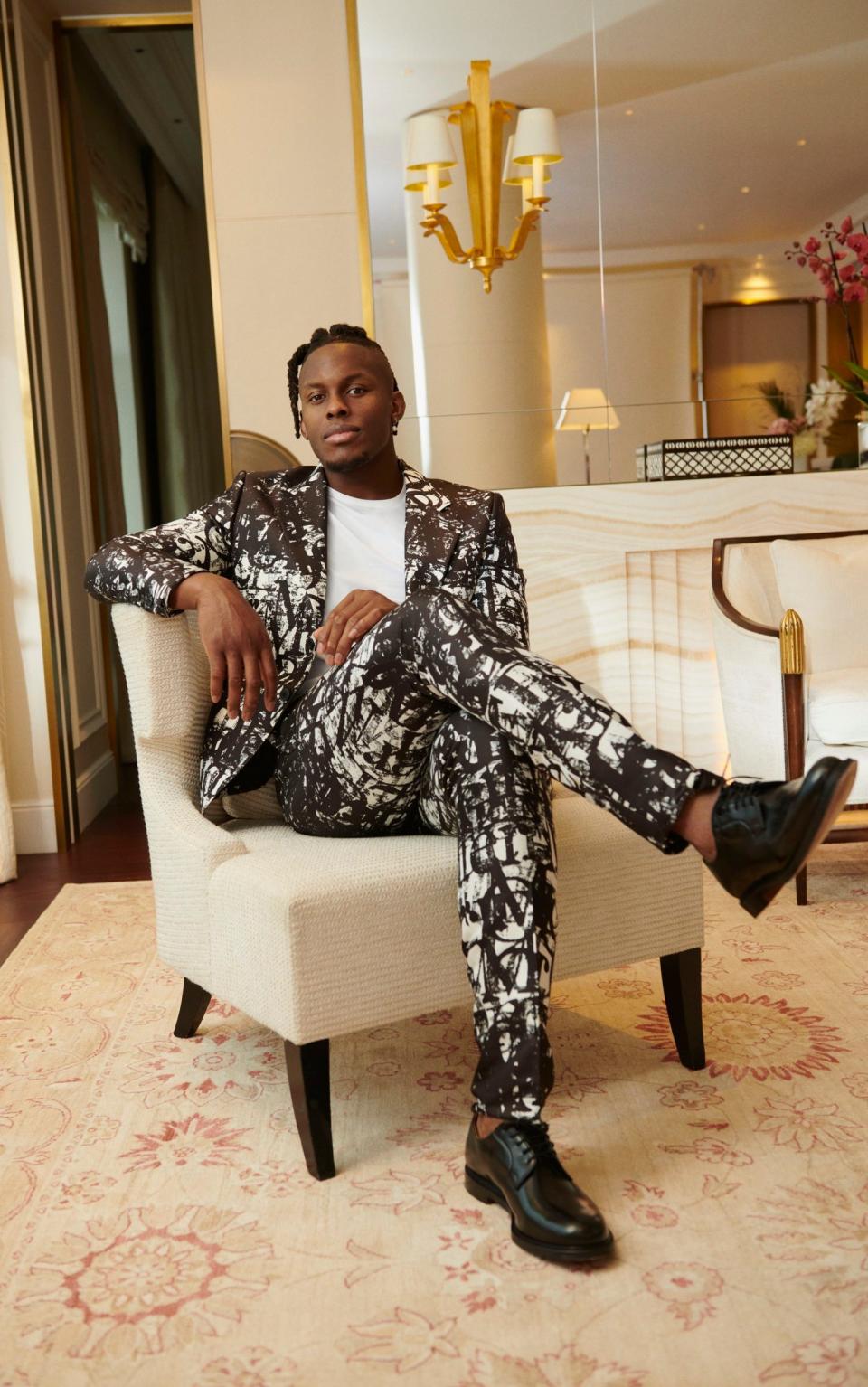 Itoje wears: suit by Alexander McQueen; T-shirt by Sunspel; shoes by Church’s - Photographs by Rosaline Shahnavaz; styling by Cheryl Konteh; grooming by Moussa Rattab