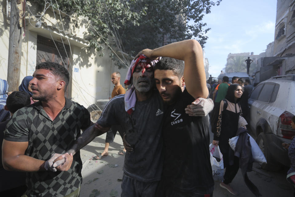 Palestinians evacuate survivors of the Israeli bombardment of the Gaza Strip in Rafah on Monday, Oct. 30, 2023. (AP Photo/Hatem Ali)