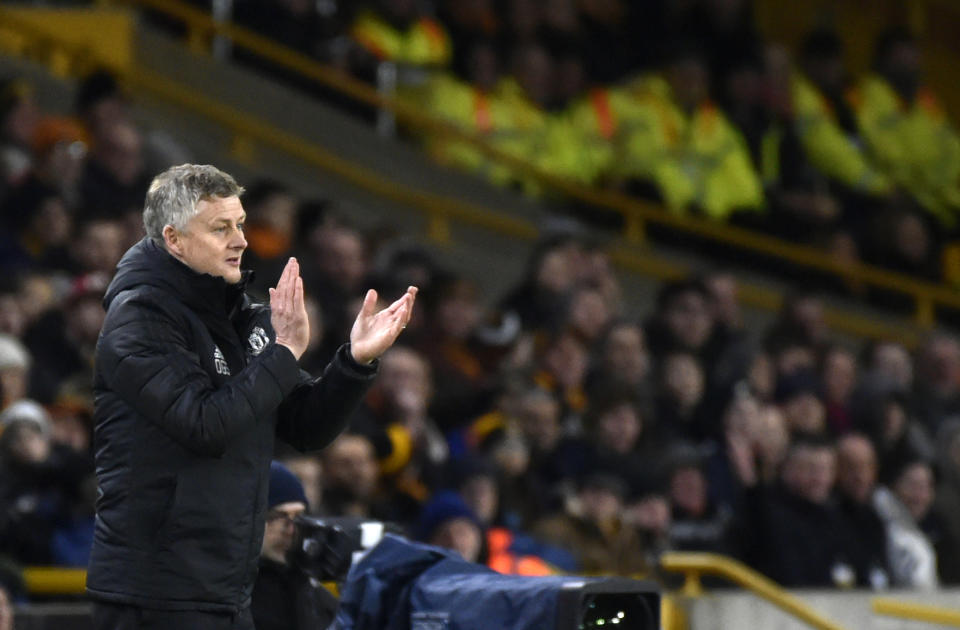 Manchester United's manager Ole Gunnar Solskjaer applauds during the English FA Cup third round soccer match between Wolverhampton Wanderers and Manchester United at the Molineux Stadium in Wolverhampton, England, Saturday, Jan. 4, 2020. (AP Photo/Rui Vieira)