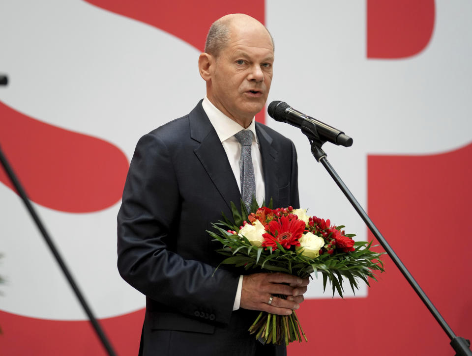 Olaf Scholz, top candidate for chancellor of the Social Democratic Party (SPD), attends a press statement at the party's headquarter in Berlin, Germany, Monday, Sept. 27, 2021. The center-left Social Democrats have won the biggest share of the vote in Germany's national election. They narrowly beat outgoing Chancellor Angela Merkel's center-right Union bloc in a closely fought race that will determine who succeeds the long-time leader at the helm of Europe's biggest economy. (AP Photo/Michael Sohn)