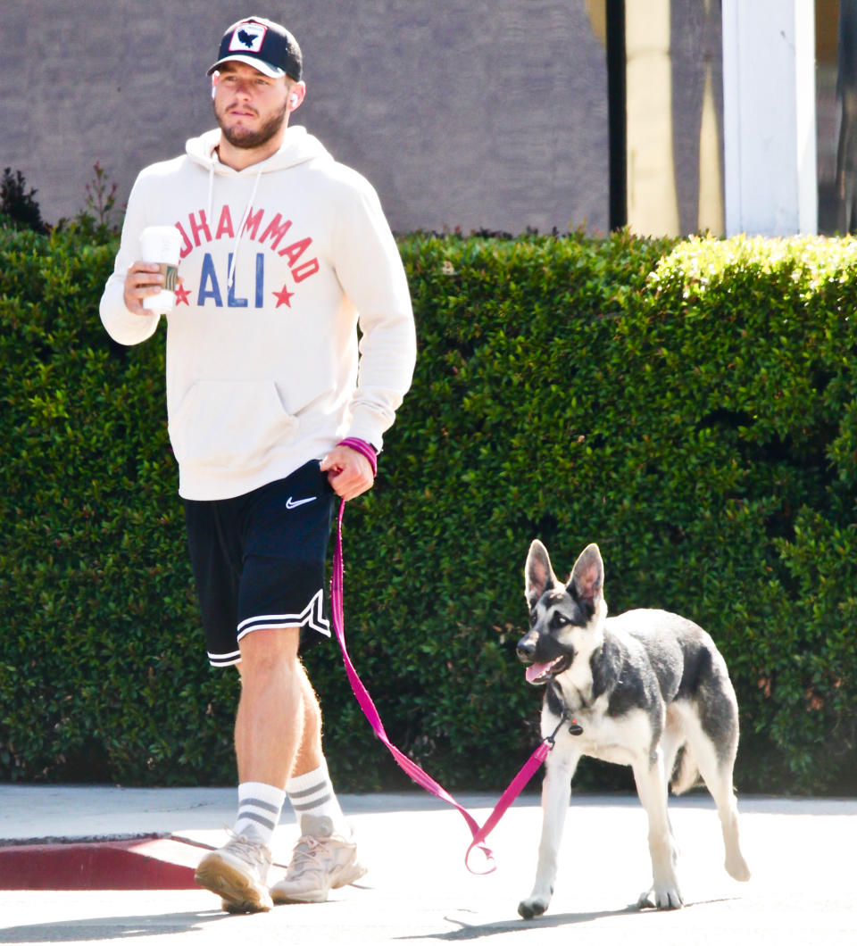 <p>Colton Underwood leads new pup Zooka as he heads out for coffee on Friday.</p>