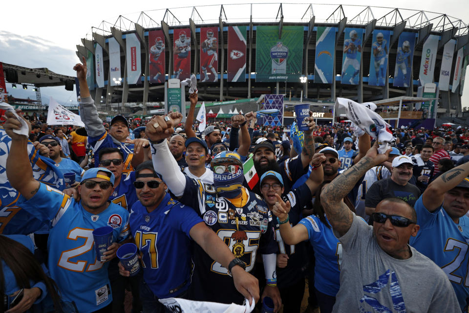 Fans cheer before an NFL football game between the Los Angeles Chargers and the Kansas City Chiefs Monday, Nov. 18, 2019, in Mexico City. (AP Photo/Rebecca Blackwell)