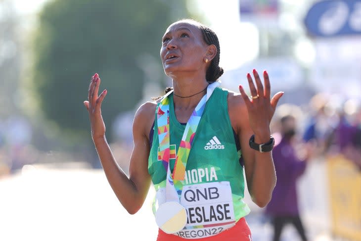 Gotytom Gebreslase celebrated after winning gold at the world championships marathon