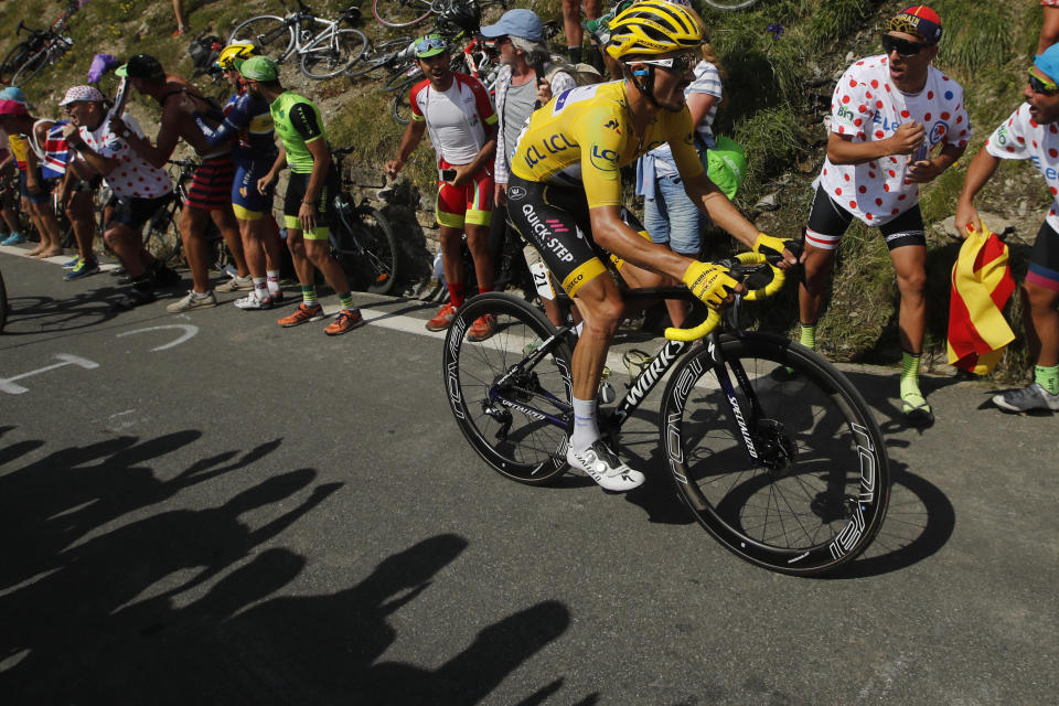 France's Julian Alaphilippe wearing the overall leader's yellow jersey climbs the Tourmalet pass during the fourteenth stage of the Tour de France cycling race over 117.5 kilometers (73 miles) with start in Tarbes and finish at the Tourmalet pass, France, Saturday, July 20, 2019. (AP Photo/ Christophe Ena)