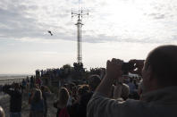 Franky Zapata, a 40-year-old inventor, takes to the air in Sangatte, Northern France, at the start of his attempt to cross the channel from France to England, aboard his flyboard, Sunday Aug. 4, 2019. Zapata will try again Sunday, to traverse the English Channel on a flying board after his first attempt failed when he crashed into a refueling boat 20 kilometers (12 miles) into the trip. (AP Photo/Michel Spingler)