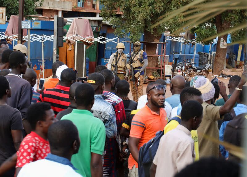 New junta's soldiers stand guard in a street of Ouagadougou