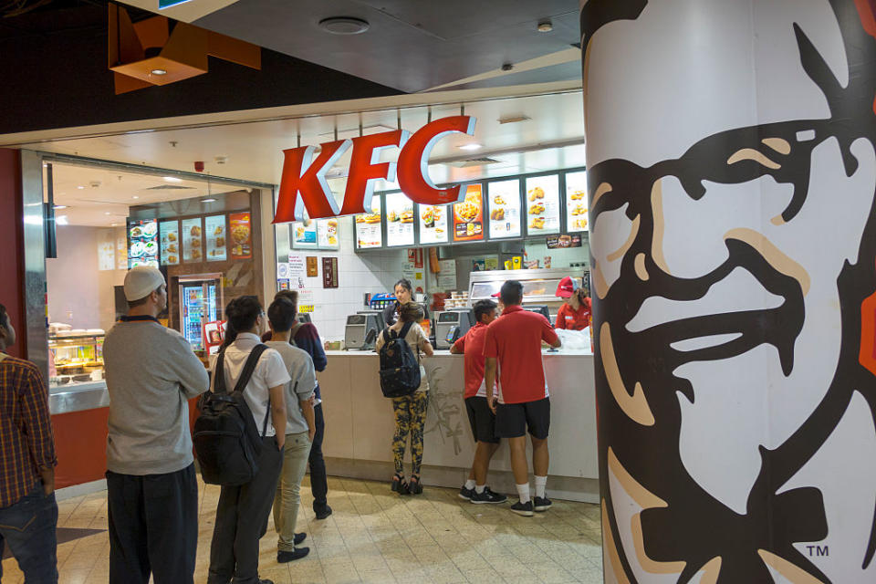 Australia, Victoria Melbourne Central Business District CBD Central Station KFC fast food restaurant tables customers line queue queuing Colonel Sanders. (Photo by: Jeff Greenberg/UIG via Getty Images)